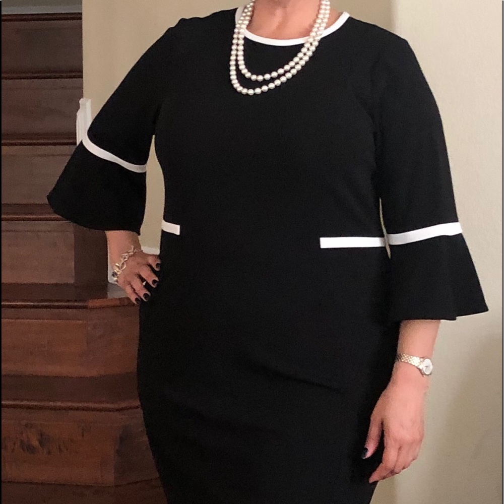 Black cocktail dress with ruffled sleeves